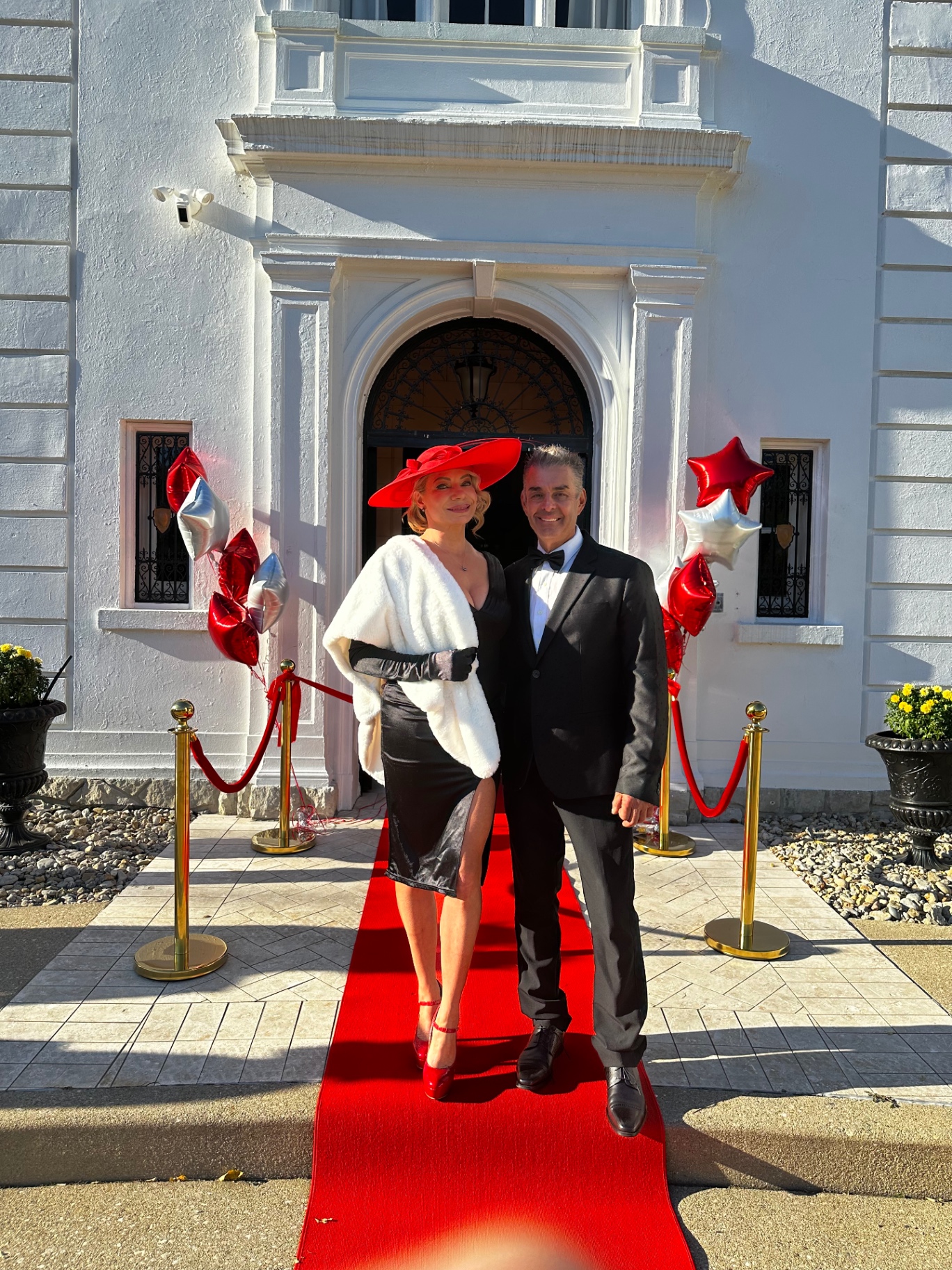 Guests posing on the red carpet at a gala event