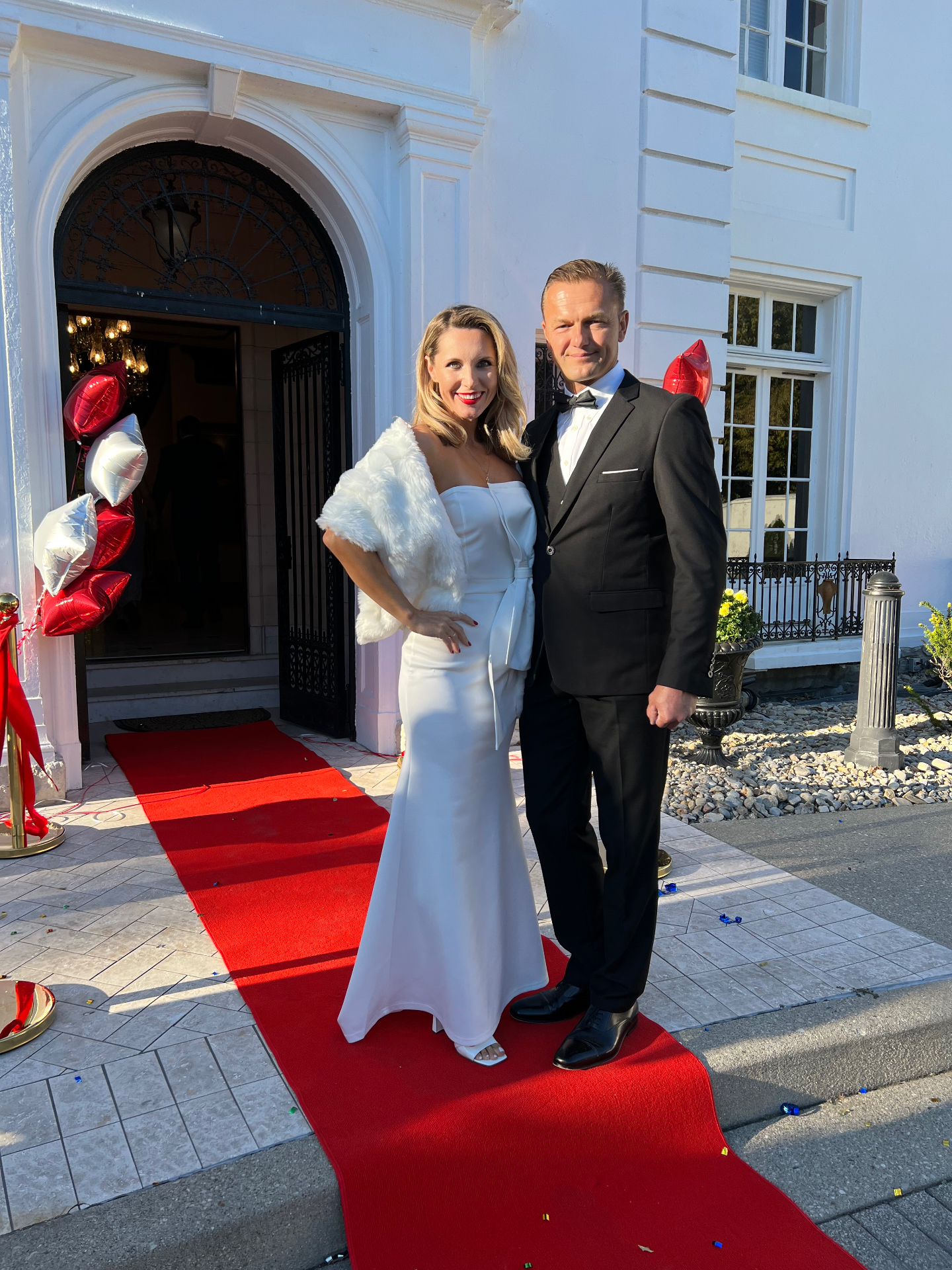 Couple celebrating on the red-carpet entrance